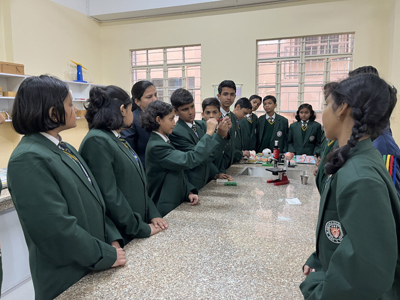 Students of class 4 utilizing modern computer science facilities